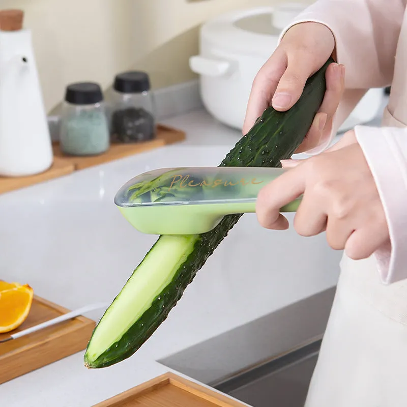 Dark green kitchen peeler with stainless steel blade stored in transparent tube case