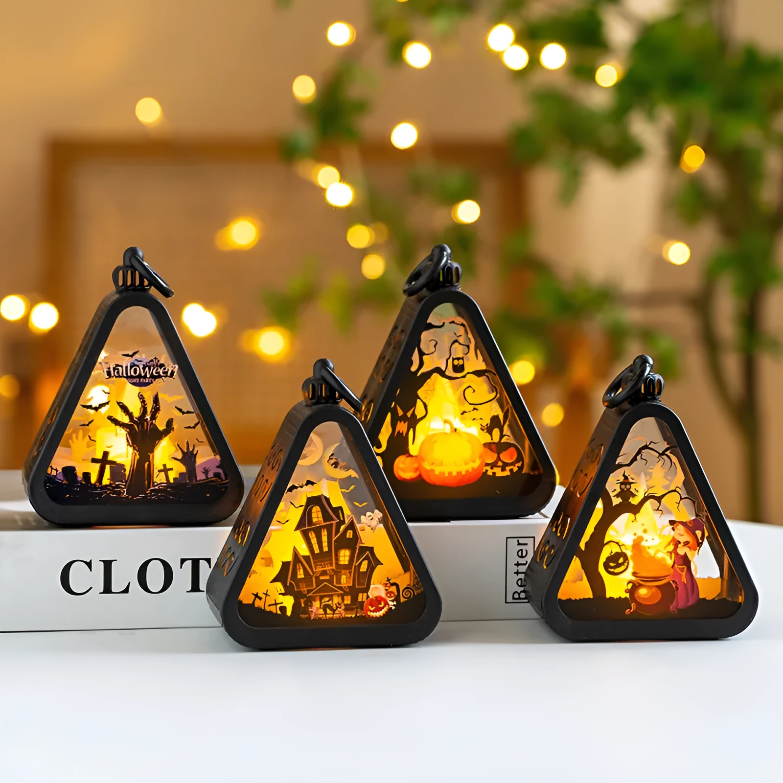 A Halloween decoration pumpkin lamp prop in plastic and glass, showing one of the four colour design options.