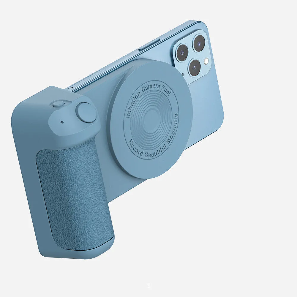 Black magnetic phone camera holder with rotatable bracket and ergonomic leather handle on a table.