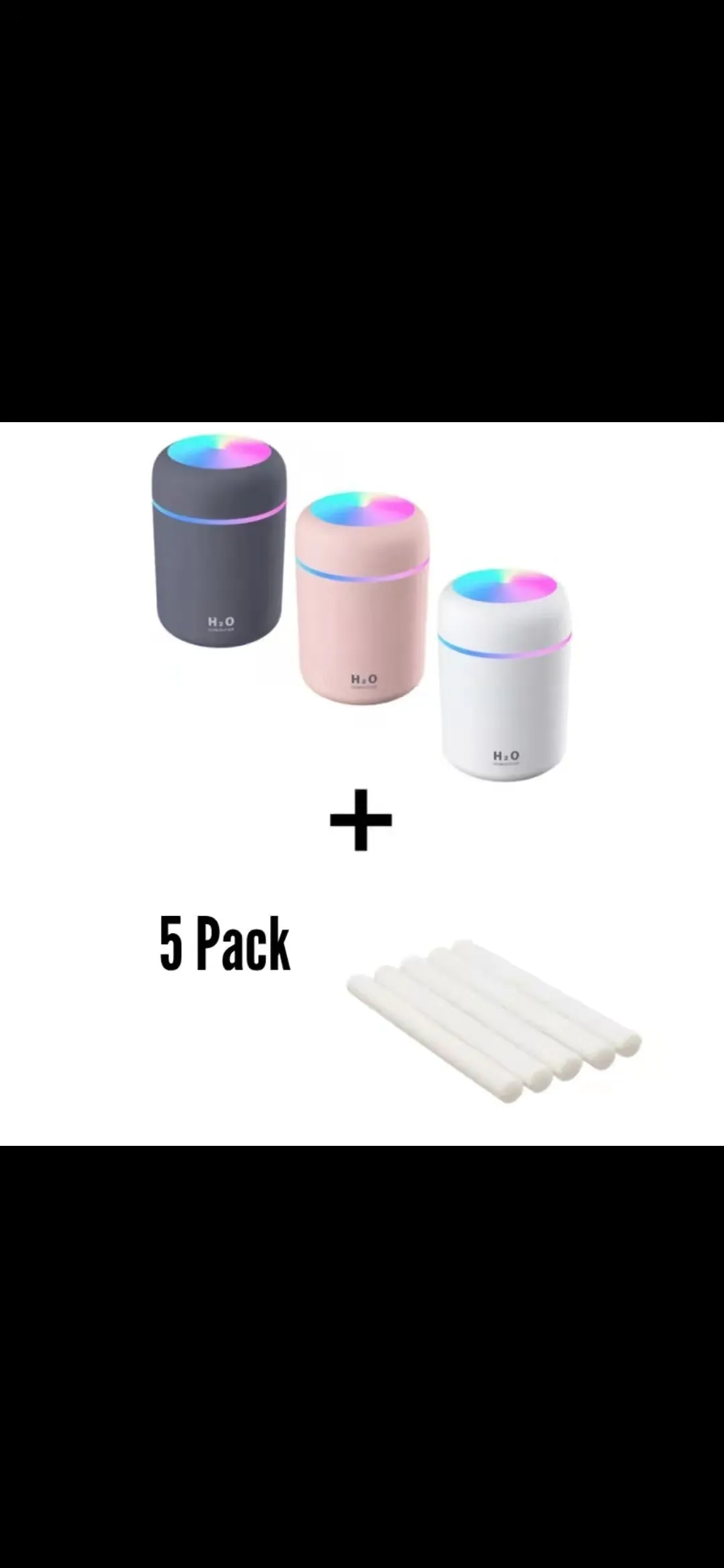 Pink, white, and navy blue USB mini silent humidifier with LED lights on a desk