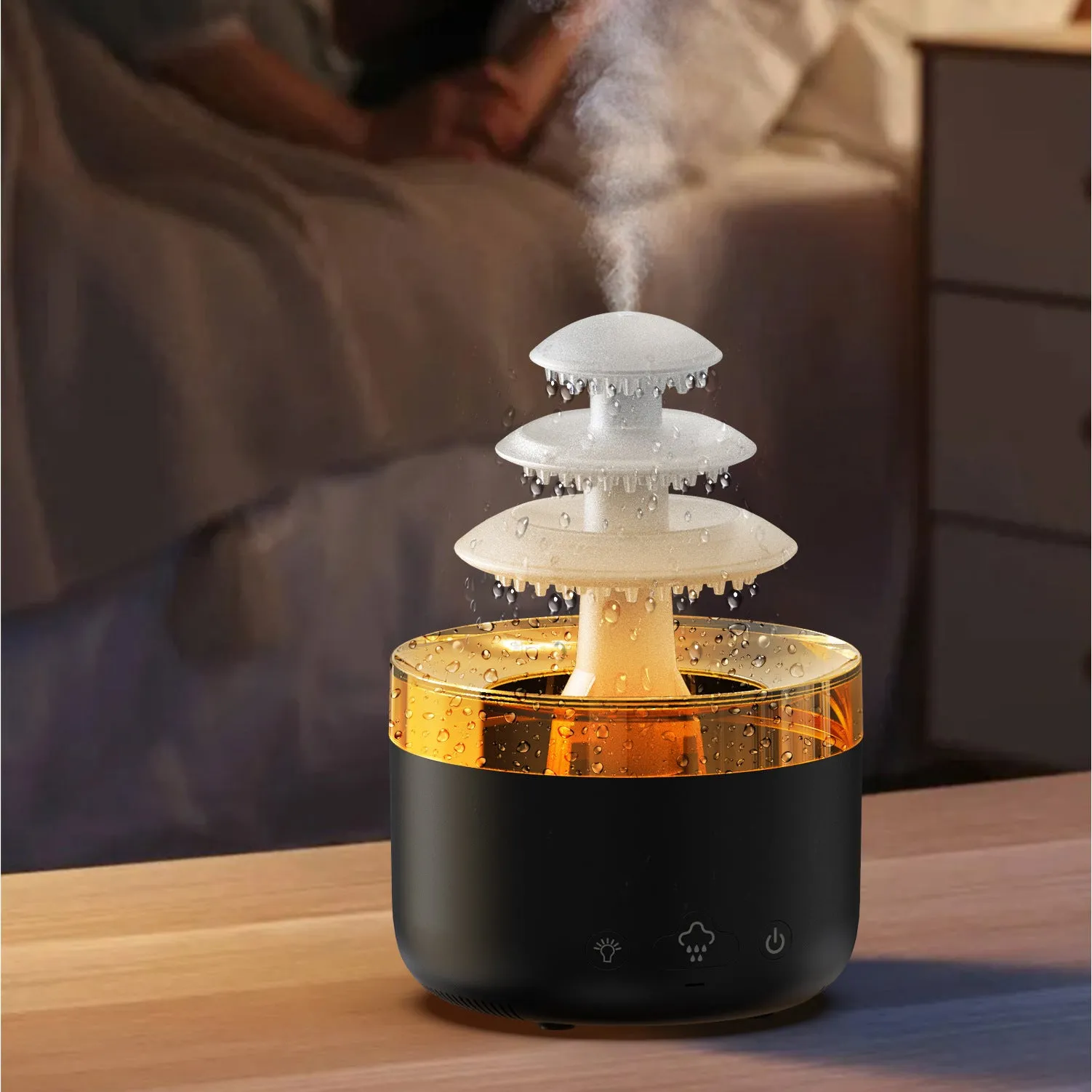 White cloud rain air humidifier and essential oil diffuser with colourful lights on wooden table