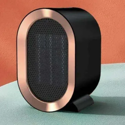 Black desktop electric heater with ceramic heating element and mechanical controls