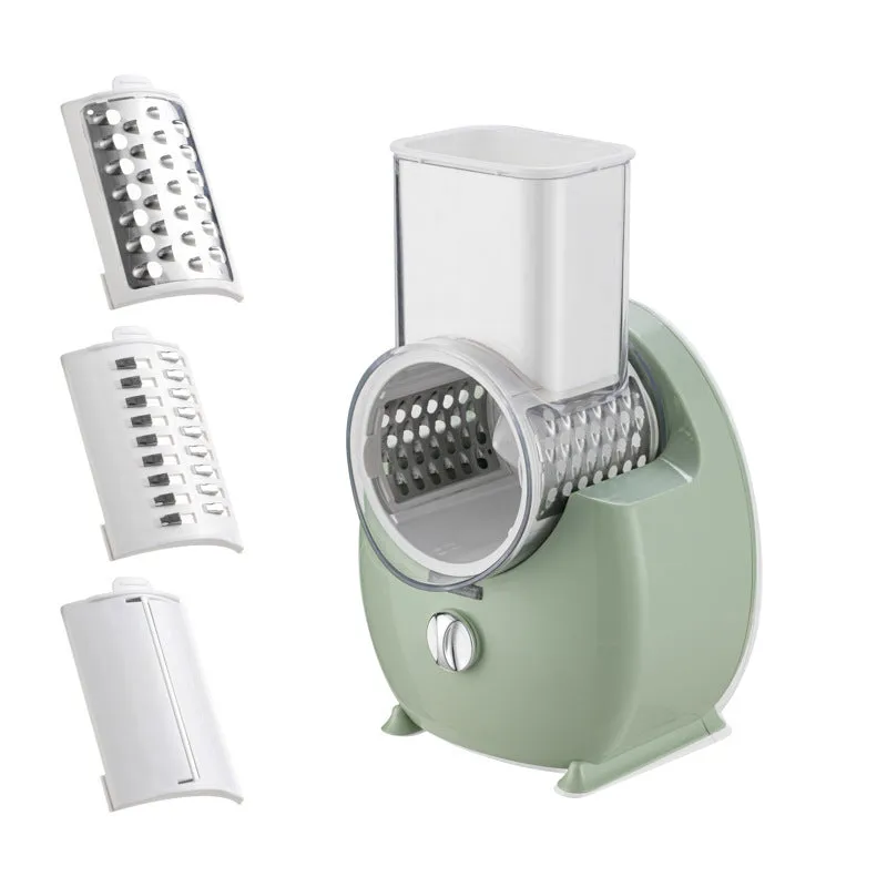 White electric vegetable slicer with rotary grater, feeding port, and multiple blade options on kitchen counter