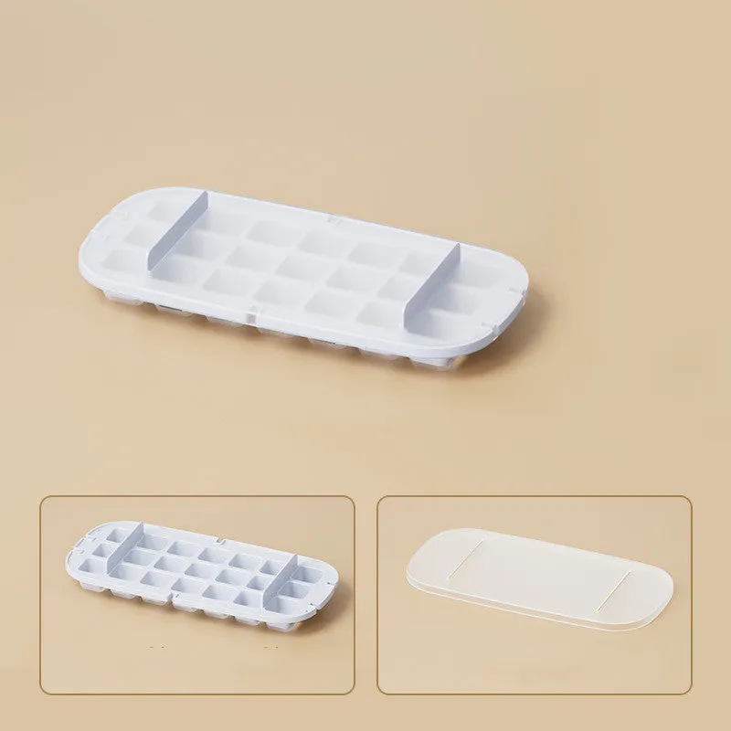 High-capacity plastic ice cube tray grid in blue colour with an ice shovel stored in its side compartment.