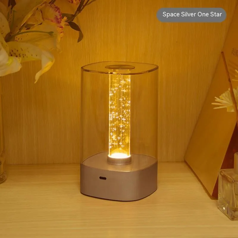 Rose gold touch-control LED bedside lamp with decorative conch pattern and USB charging cable