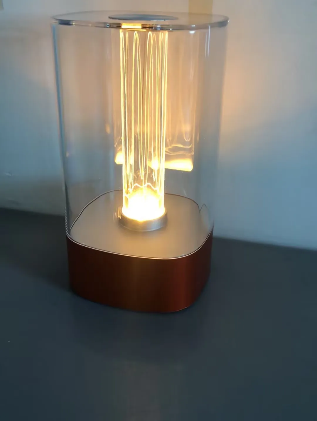 Rose gold touch-control LED bedside lamp with decorative conch pattern and USB charging cable