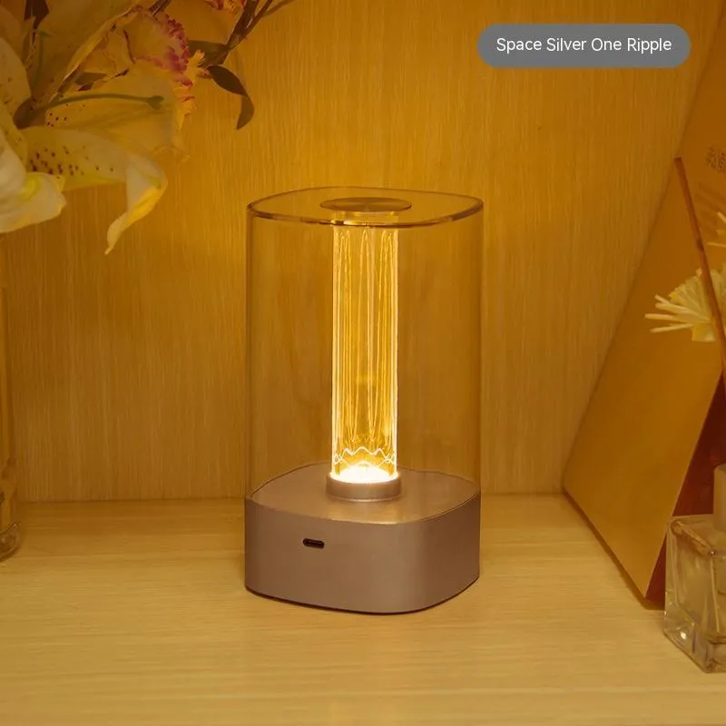 Rose gold touch-control LED bedside lamp with decorative conch pattern and USB charging cable