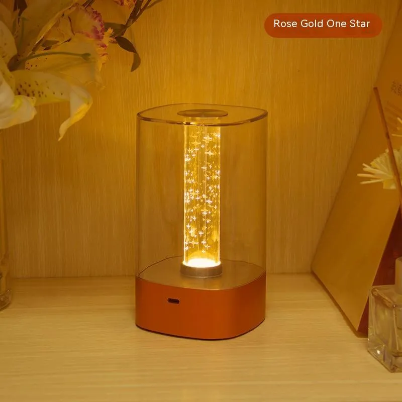 Rose gold touch-control LED bedside lamp with decorative conch pattern and USB charging cable