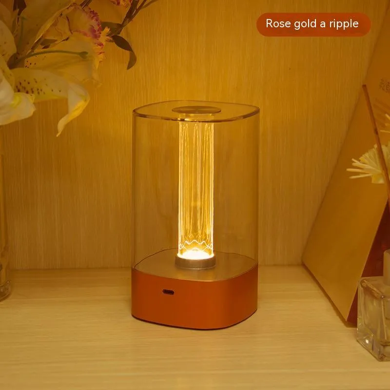 Rose gold touch-control LED bedside lamp with decorative conch pattern and USB charging cable