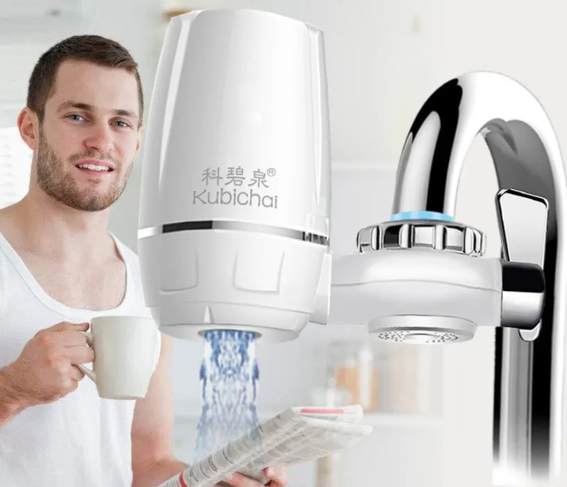 White plastic kitchen tap water filter with ceramic cartridge and universal screw thread adapters