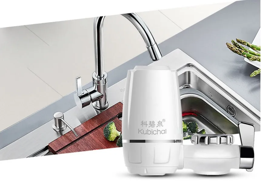 White plastic kitchen tap water filter with ceramic cartridge and universal screw thread adapters