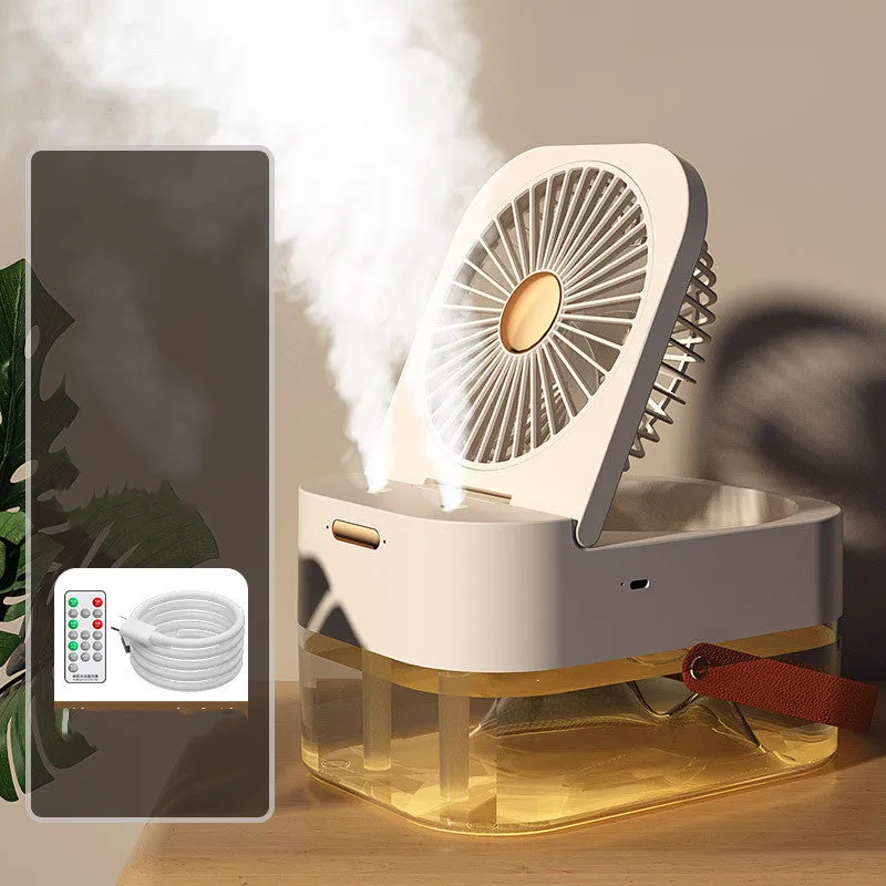 Pearl white desktop humidifier cooling fan with water tank, remote control, and night light on a wooden desk.
