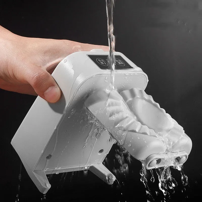 White automatic electric dumpling maker machine with USB cable on a kitchen counter.