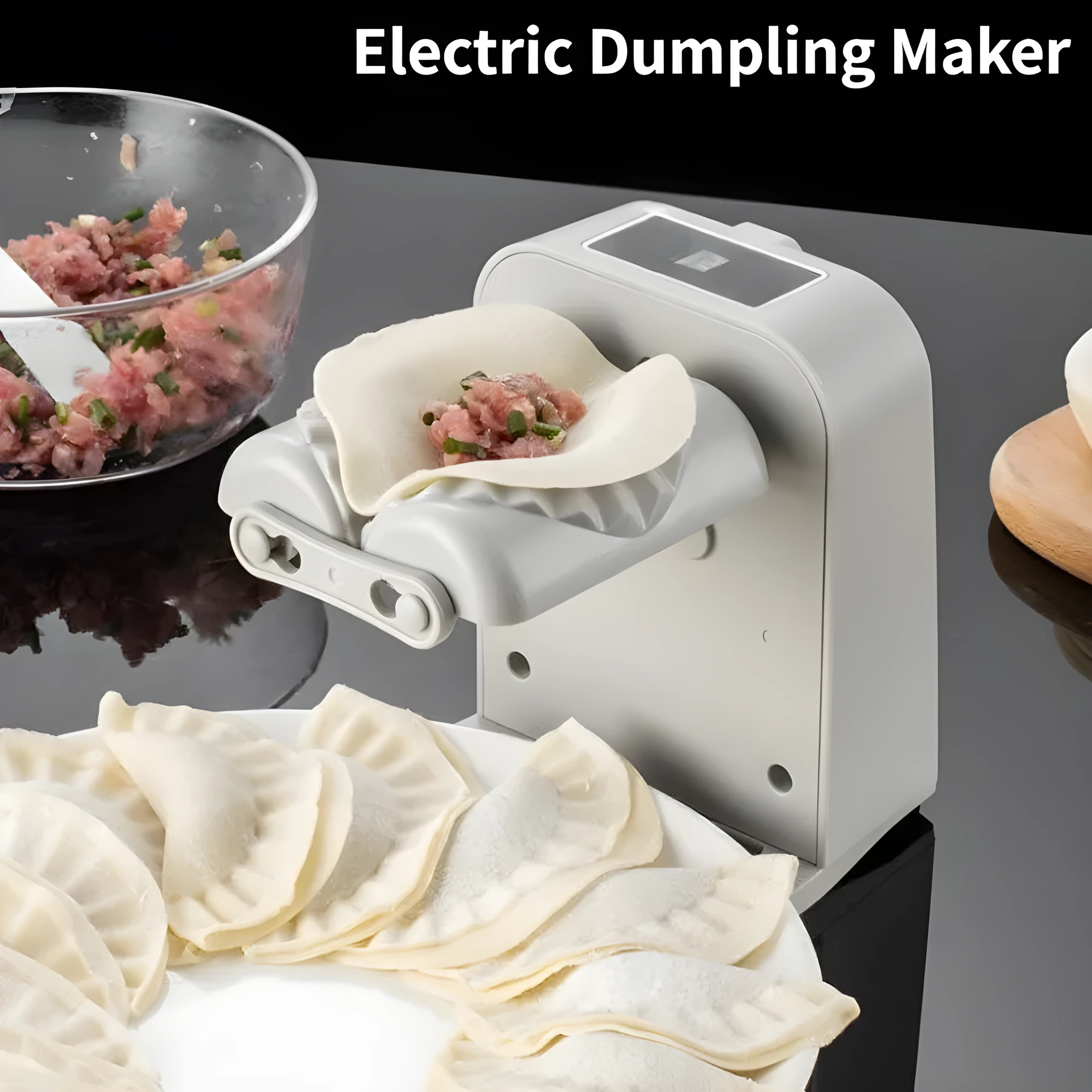White automatic electric dumpling maker machine with USB cable on a kitchen counter.