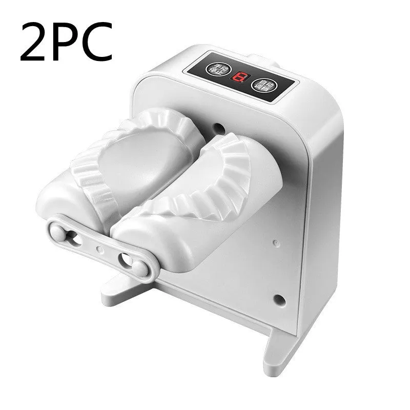 White automatic electric dumpling maker machine with USB cable on a kitchen counter.
