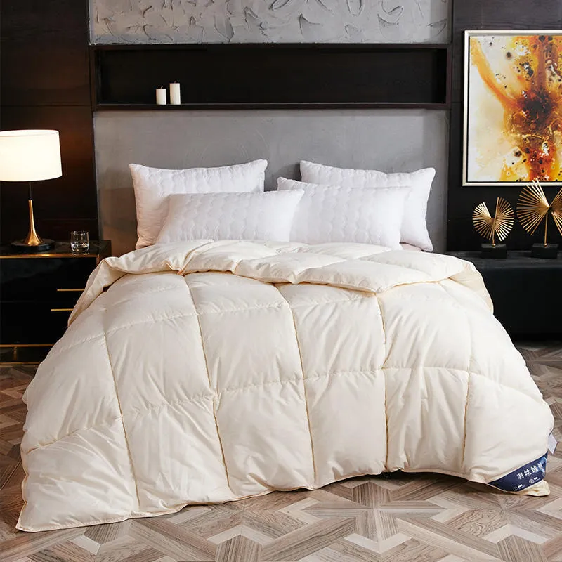 Goose down winter duvet in pink colour on a bed, showing twill weave fabric texture.