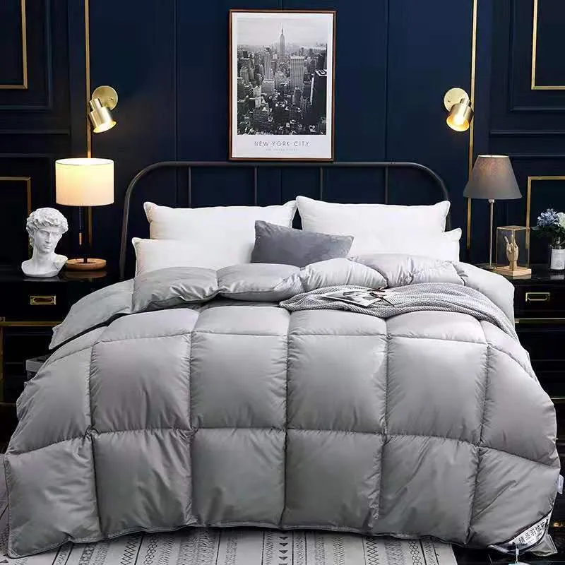 Goose down winter duvet in pink colour on a bed, showing twill weave fabric texture.