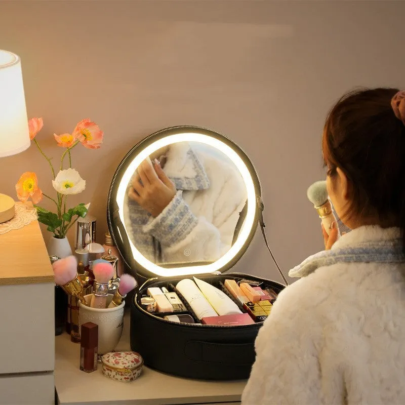 Round pink PU leather LED makeup bag open showing internal mirror, lights, and lattice partitions.