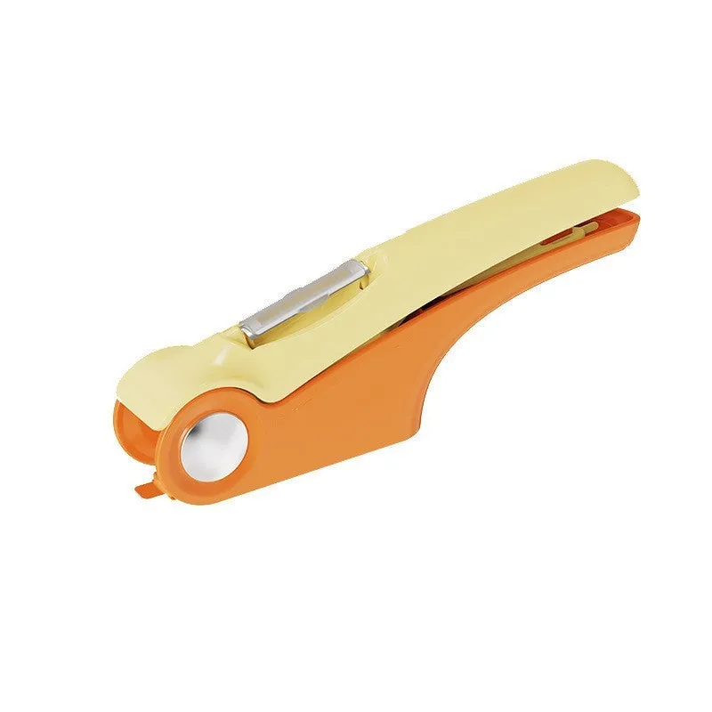 Manual garlic press with stainless steel head and coloured ABS plastic handles