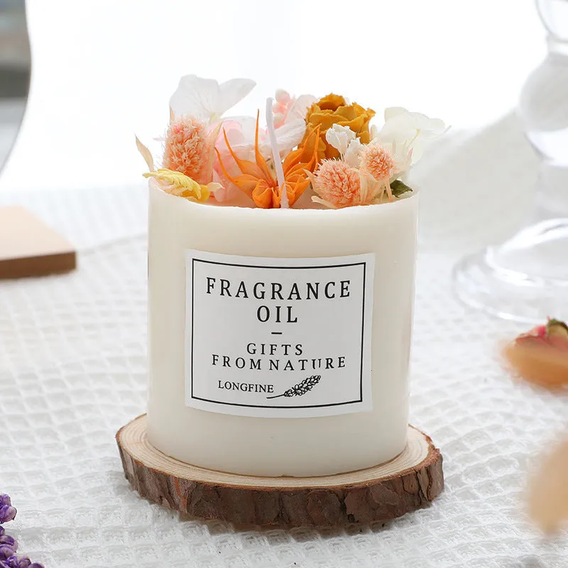 Dried flowers decor romantic aromatherapy candle in a jar with embedded botanicals.