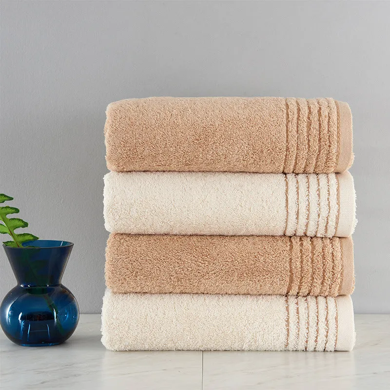 Beige and brown cotton towel set showing small, hand, and bath towel sizes.
