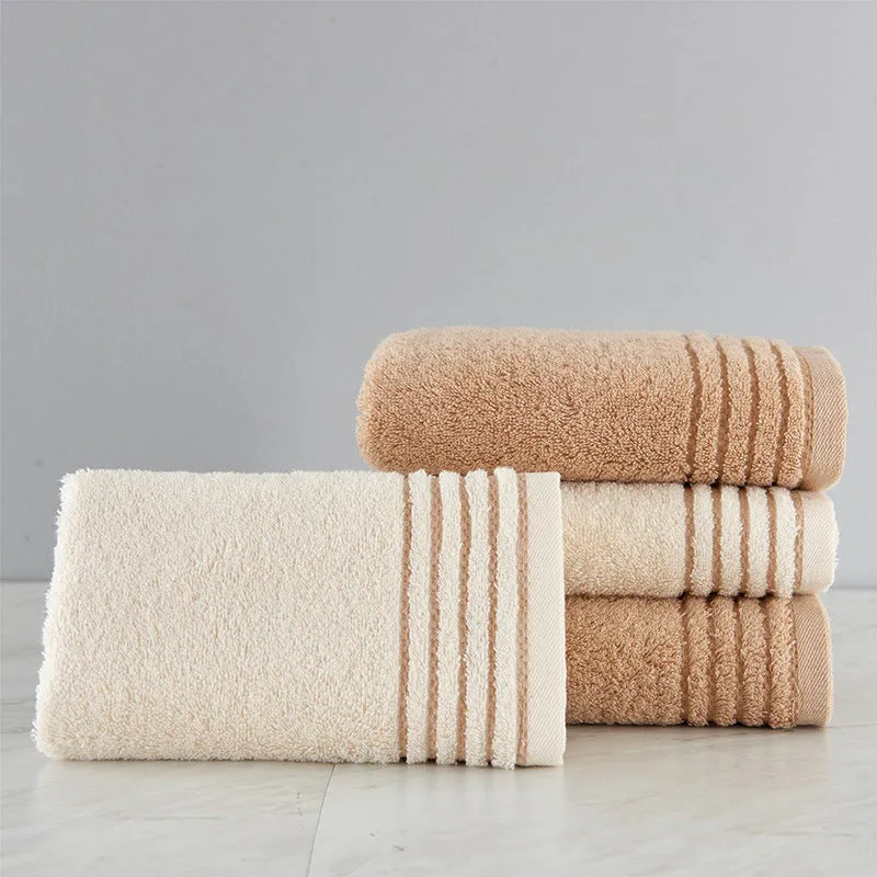 Beige and brown cotton towel set showing small, hand, and bath towel sizes.