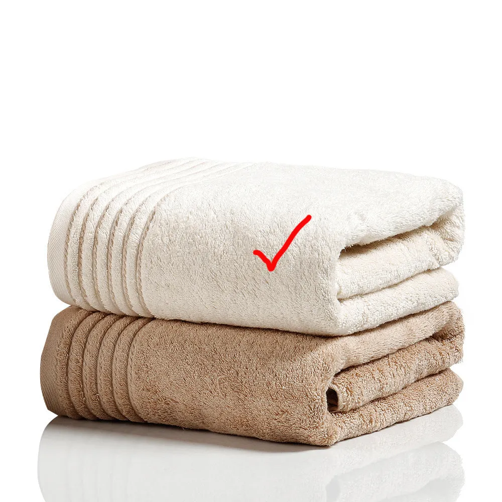 Beige and brown cotton towel set showing small, hand, and bath towel sizes.