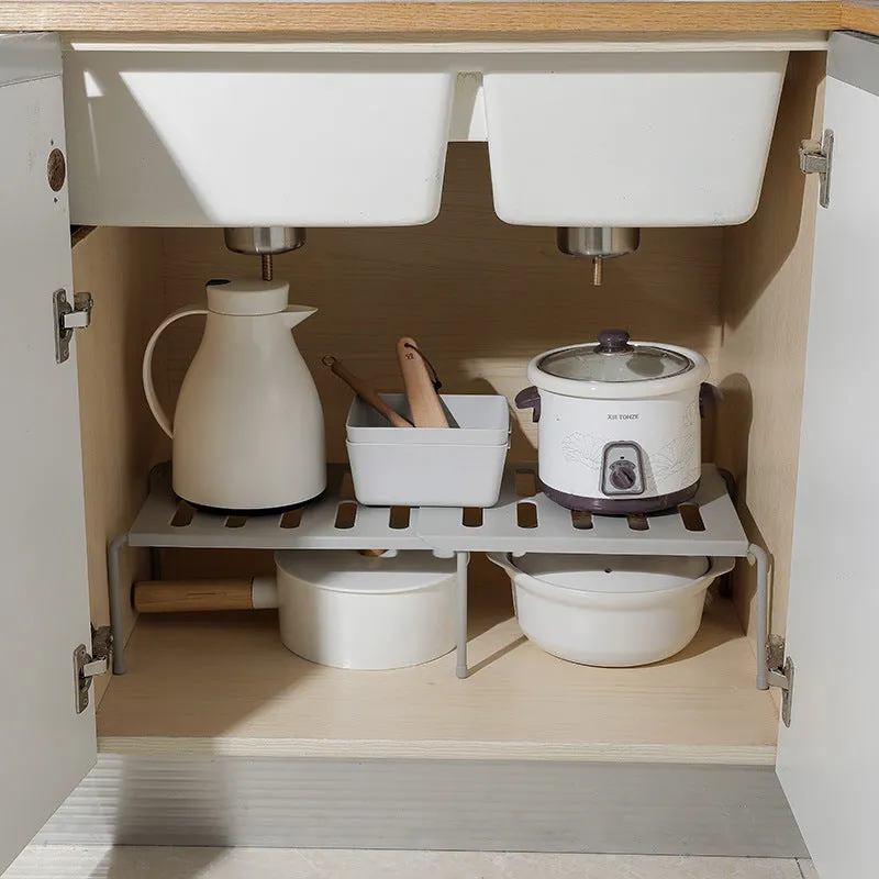 White telescopic kitchen rack with adjustable height showing extended and compressed positions