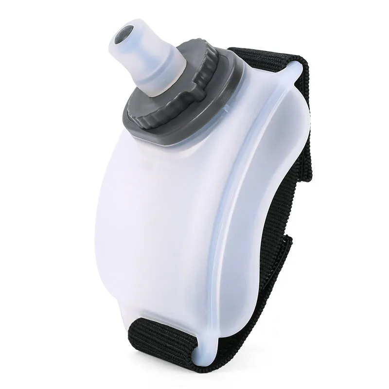 Orange wrist-mounted sports water bottle with Velcro strap for cycling and running hydration