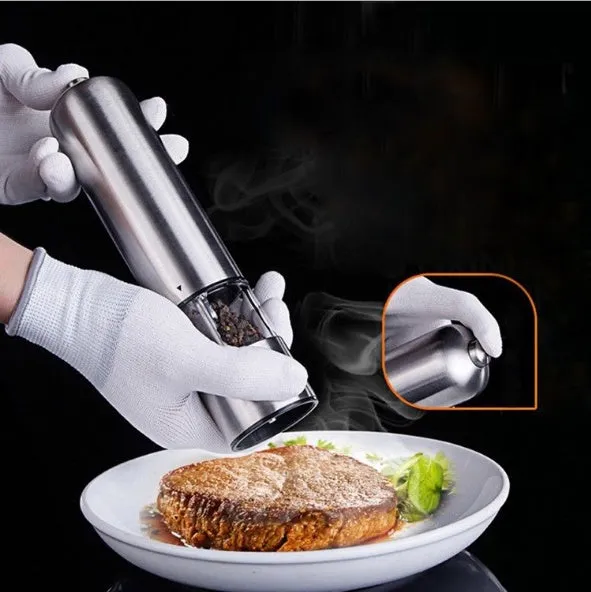 Stainless steel electric pepper grinder with natural colour finish, showing adjustable coarseness dial.