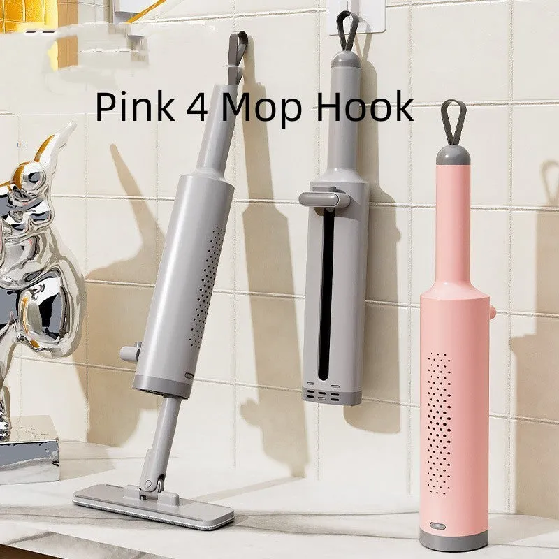 Pink rotatable self-squeeze mini flat mop with microfiber pad, shown extended to its full length.