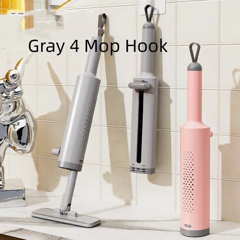 Pink rotatable self-squeeze mini flat mop with microfiber pad, shown extended to its full length.
