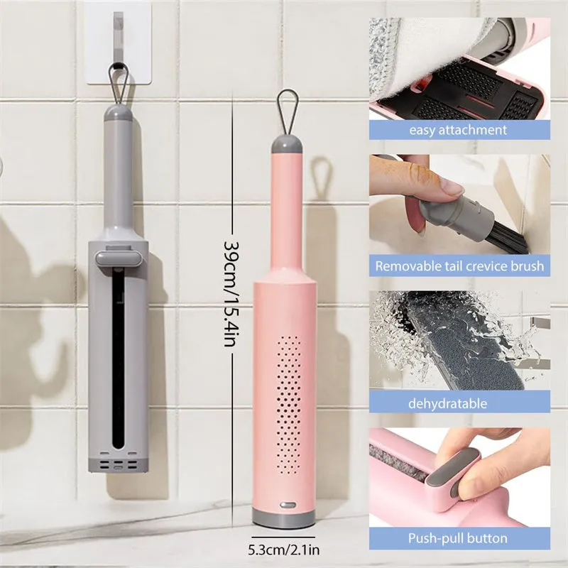 Pink rotatable self-squeeze mini flat mop with microfiber pad, shown extended to its full length.