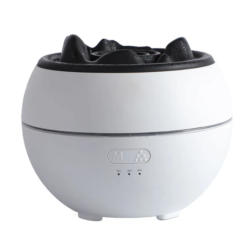 White round flame aroma diffuser humidifier with timer settings on a desk.