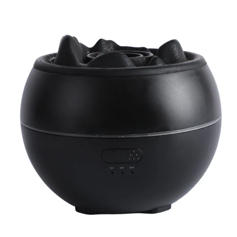 White round flame aroma diffuser humidifier with timer settings on a desk.
