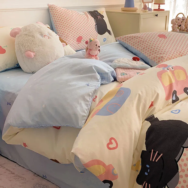 Cartoon dog pattern pure cotton four-piece bedding set shown on a bed, includes multiple size options.