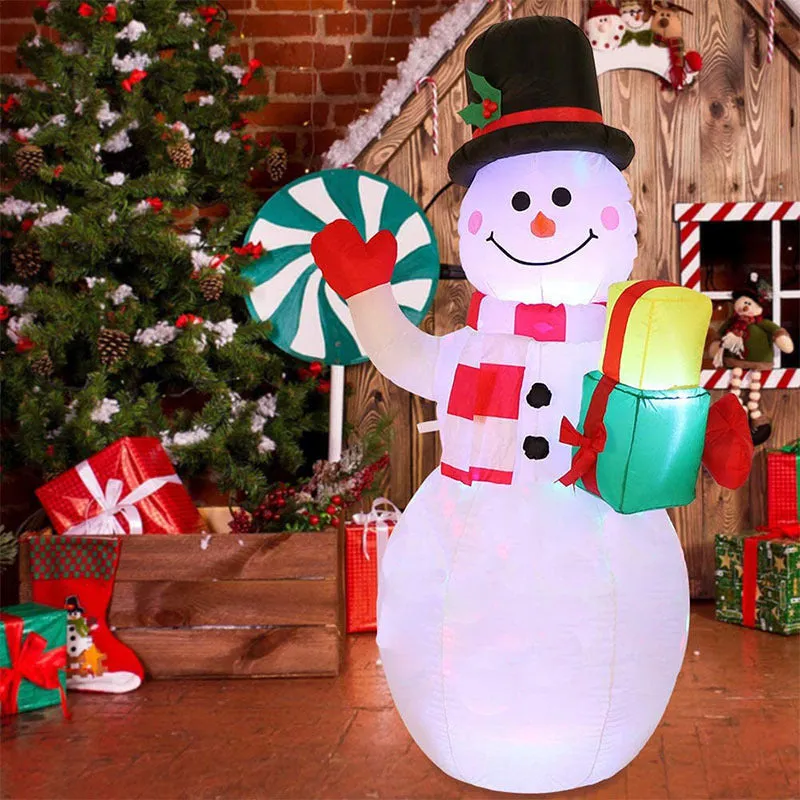 Glowing LED inflatable Christmas decorations including Santa, snowman, and a Christmas tree for outdoor garden use.