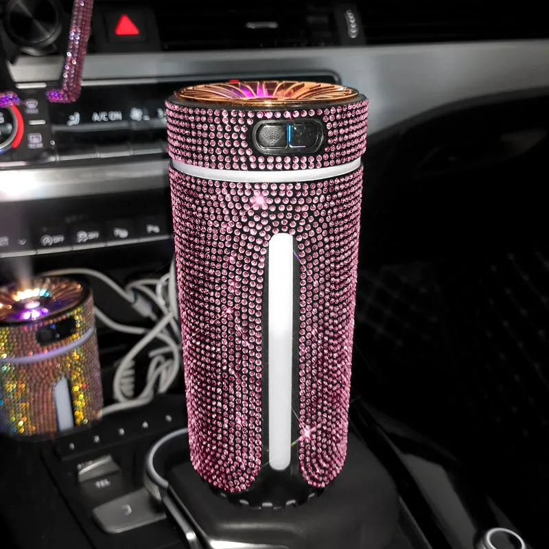 Rhinestone-decorated USB car humidifier with LED lights on a dark background.