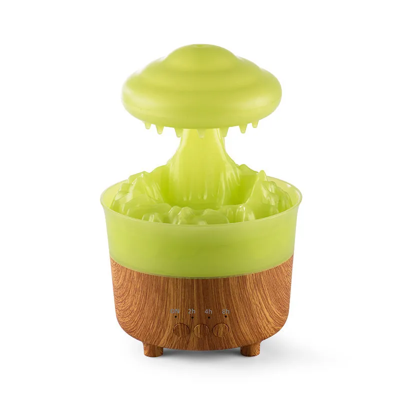 Wood grain white rain cloud shaped humidifier, diffuser, and night light on a table.