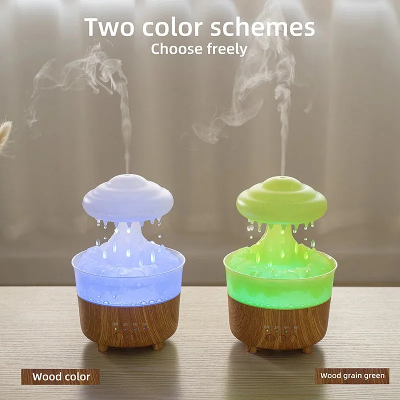 Wood grain white rain cloud shaped humidifier, diffuser, and night light on a table.