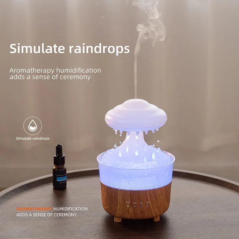Wood grain white rain cloud shaped humidifier, diffuser, and night light on a table.