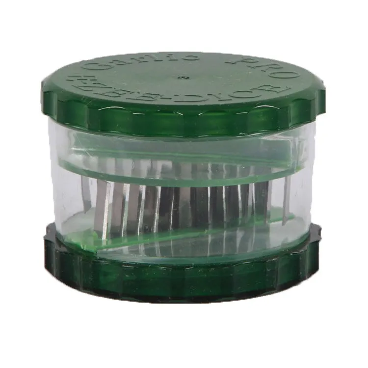 Green transparent plastic garlic peeler with silicone roller for removing skins.