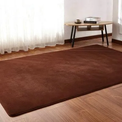 White plush lambswool rectangular area rug with non-slip dotted bottom on wooden floor