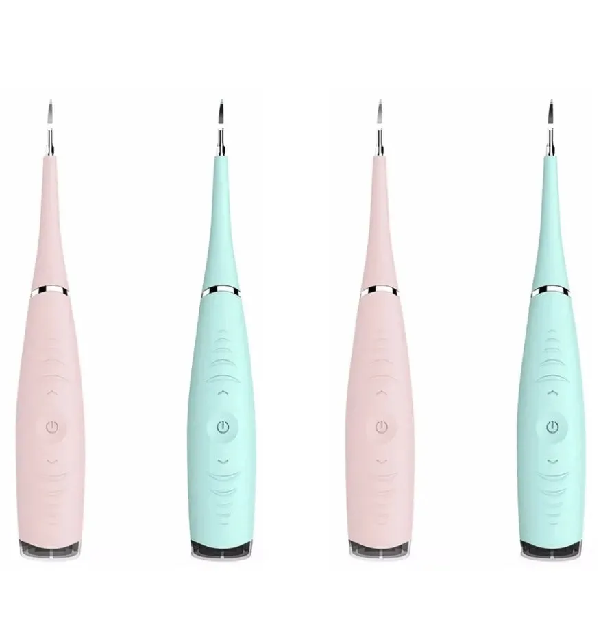 Pink or blue waterproof electric toothbrush care tool for removing dental calculus on a bathroom counter.