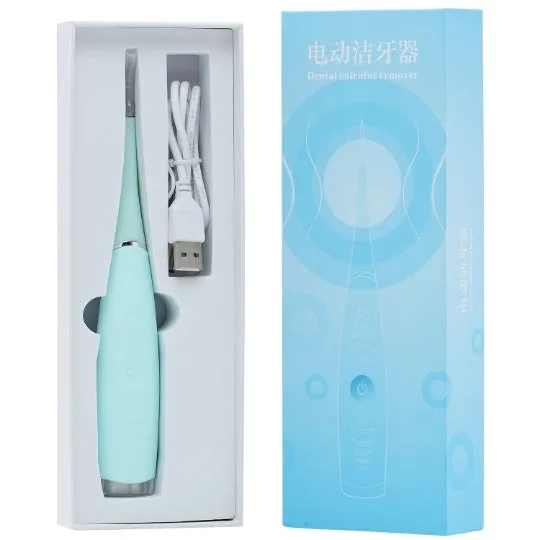 Pink or blue waterproof electric toothbrush care tool for removing dental calculus on a bathroom counter.
