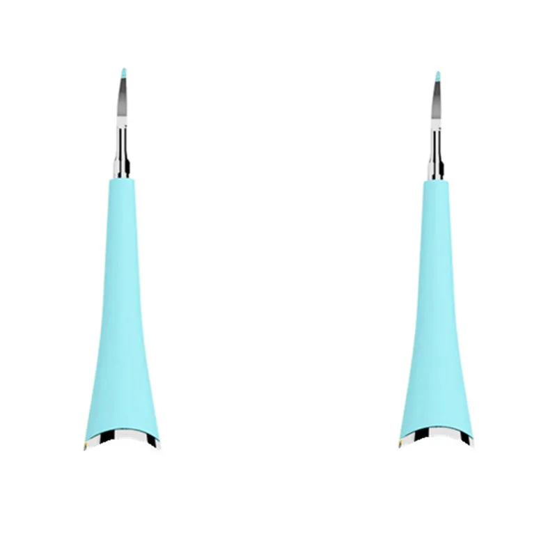 Pink or blue waterproof electric toothbrush care tool for removing dental calculus on a bathroom counter.
