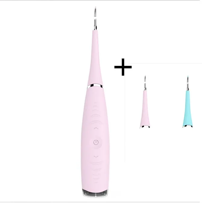 Pink or blue waterproof electric toothbrush care tool for removing dental calculus on a bathroom counter.