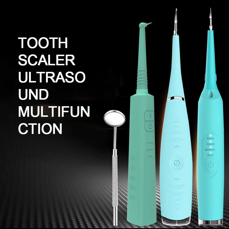 Pink or blue waterproof electric toothbrush care tool for removing dental calculus on a bathroom counter.