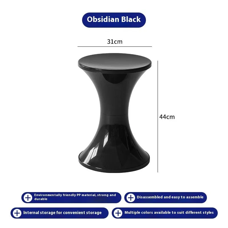 A white hourglass-shaped plastic shoe changing stool on a wooden floor.