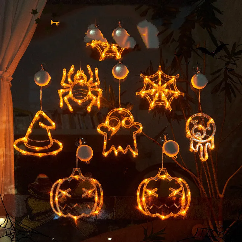 Halloween LED window lights with suction cups showing ghost, spider, and pumpkin decorations